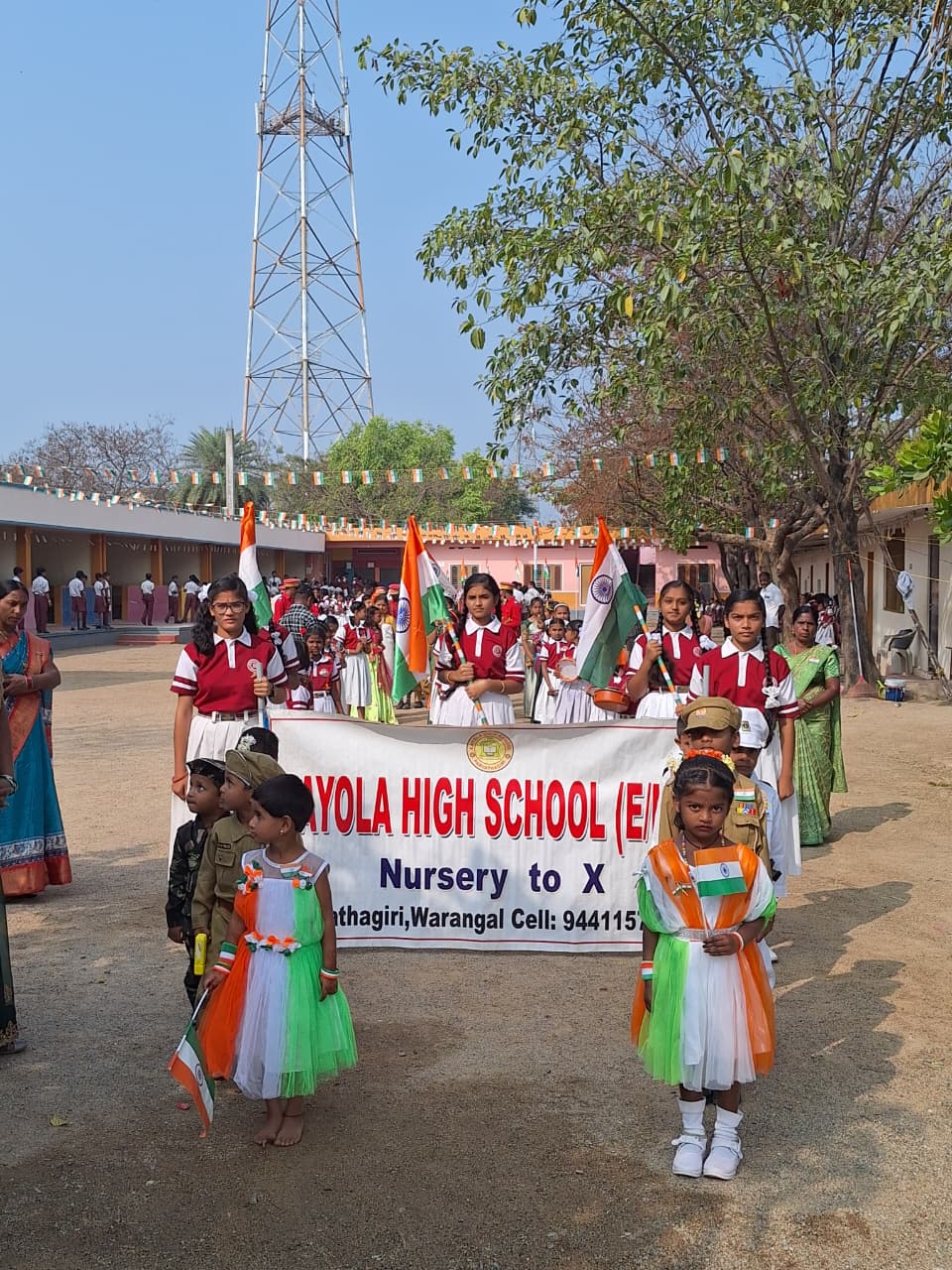 Students carrying a school banner in a march