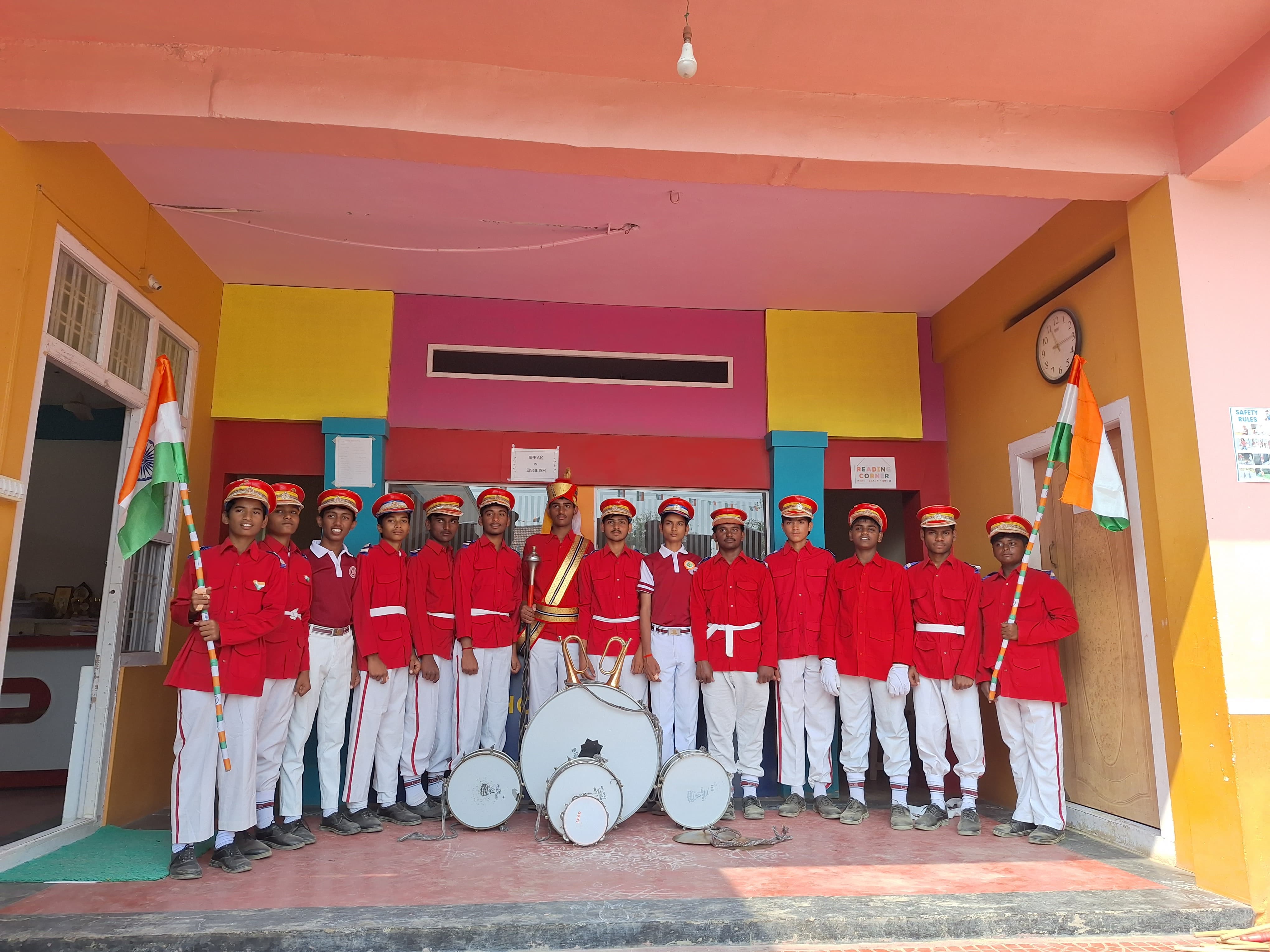 A student band standing in formation inside the school building